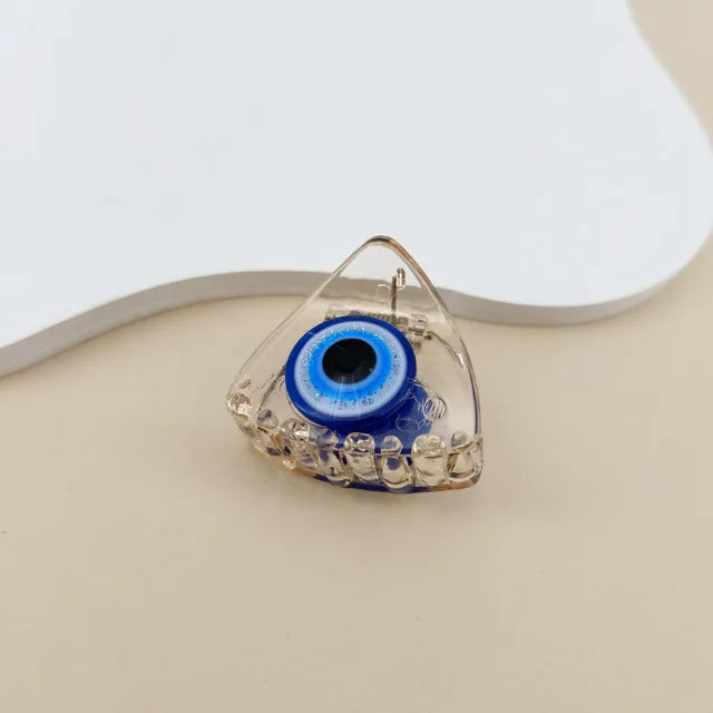 Vintage evil eye hair claw clip in clear acrylic with blue eye detail — Solara Gold